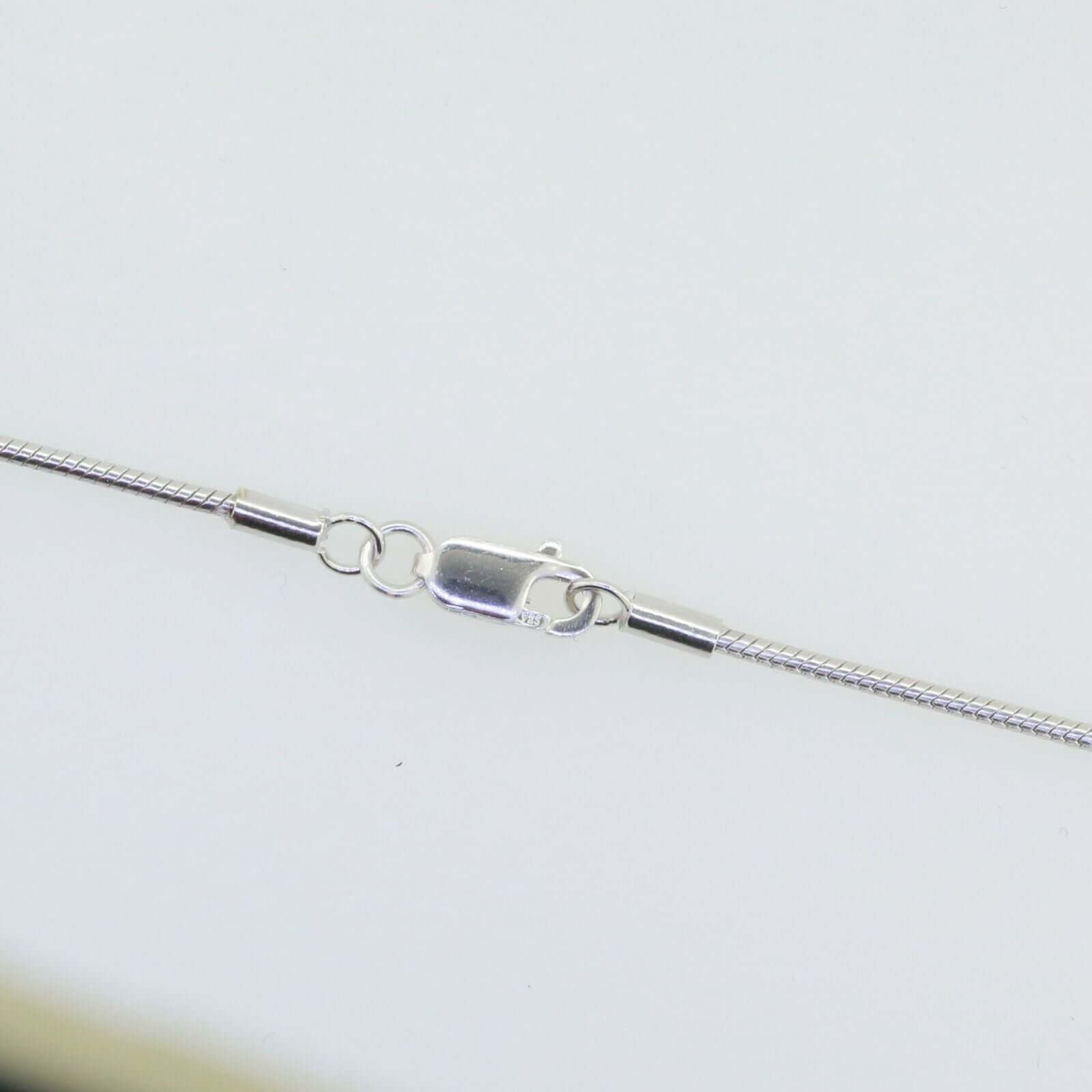 Close-up of a sterling silver snake chain necklace clasp, showcasing 925 rhodium-plated metal finish.