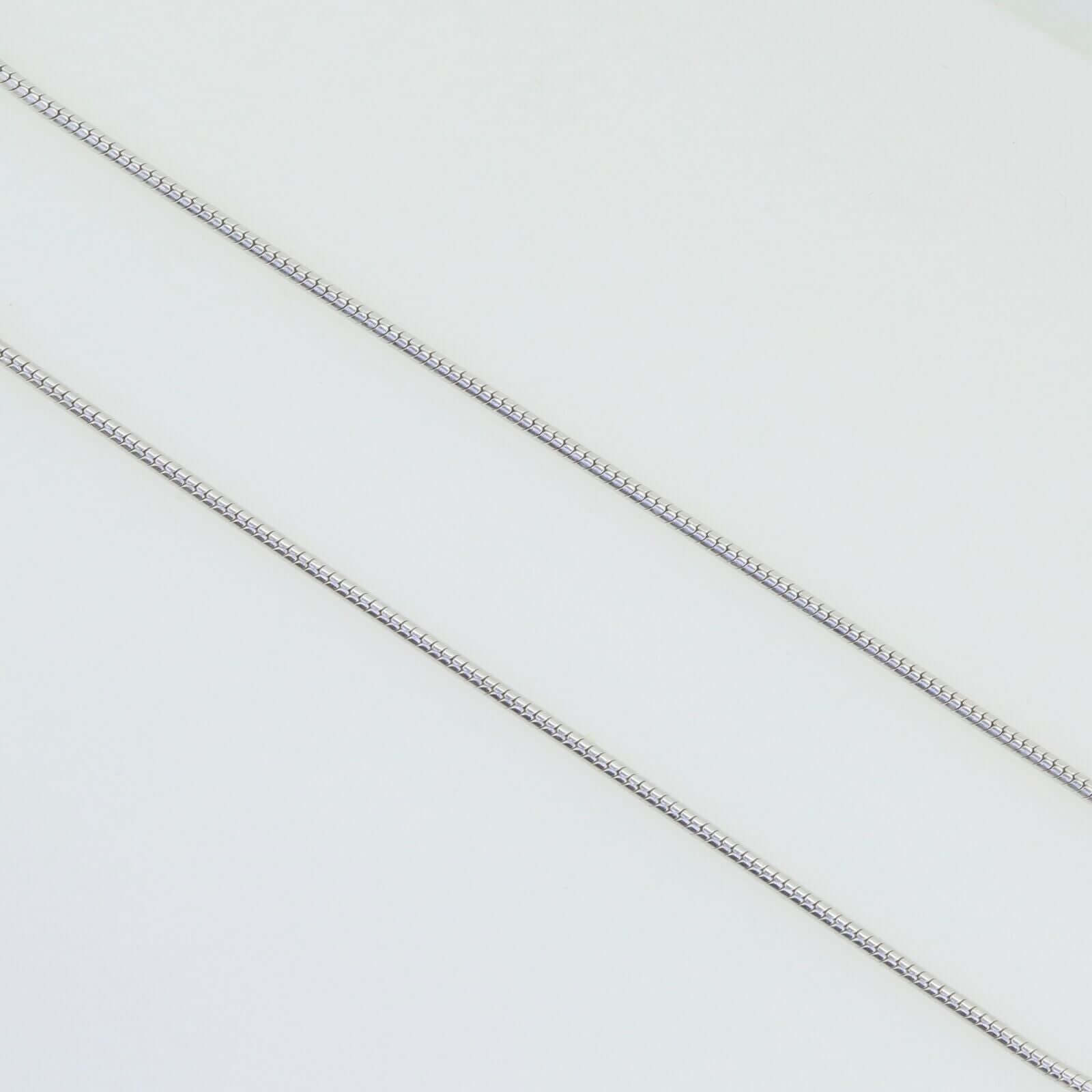 Close-up of solid 925 sterling silver snake chain necklaces in various thicknesses on white background.