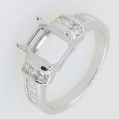 Sterling silver semi mount ring setting with sparkling white topaz, designed for a 9x7mm emerald gemstone.