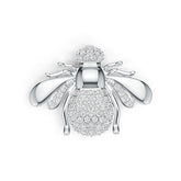 Silver bee-shaped brooch with diamond accents on a white background