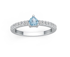 Silver ring with a blue gemstone on a white background