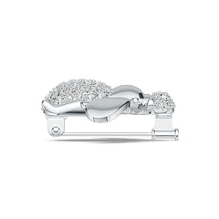 Silver brooch with gemstones on a white background