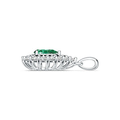 Silver ring with a green gemstone and small diamonds on a white background