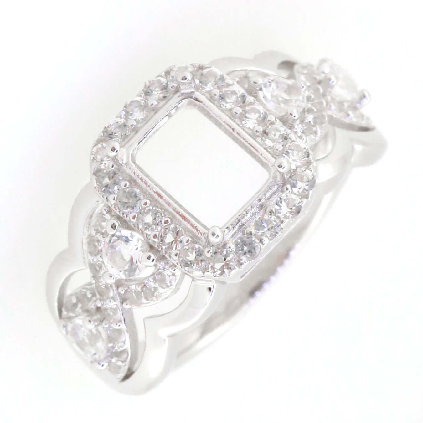 Sterling silver semi mount ring setting featuring a crisscross swirl shank with white topaz stones, size 8x6mm.
