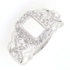 Sterling silver semi mount ring setting featuring a crisscross swirl shank with white topaz stones, size 8x6mm.