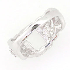 Sterling silver semi mount ring setting with crisscross swirl shank for 8x6mm emerald, white topaz accents.