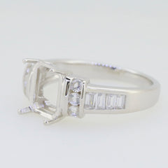 Sterling silver semi mount ring setting featuring a 9x7mm emerald-cut design with white topaz accents.